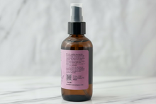 Load image into Gallery viewer, Lavender Skincare Oil with a pink label on a marble background