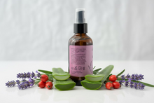 Load image into Gallery viewer, Lavender Skincare Oil with a pink label on a white background surrounded with ingredients lavender, aloe vera, rose hip