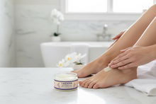 Load image into Gallery viewer, Lavender Moisturizing Balm applied to foot in bathroom
